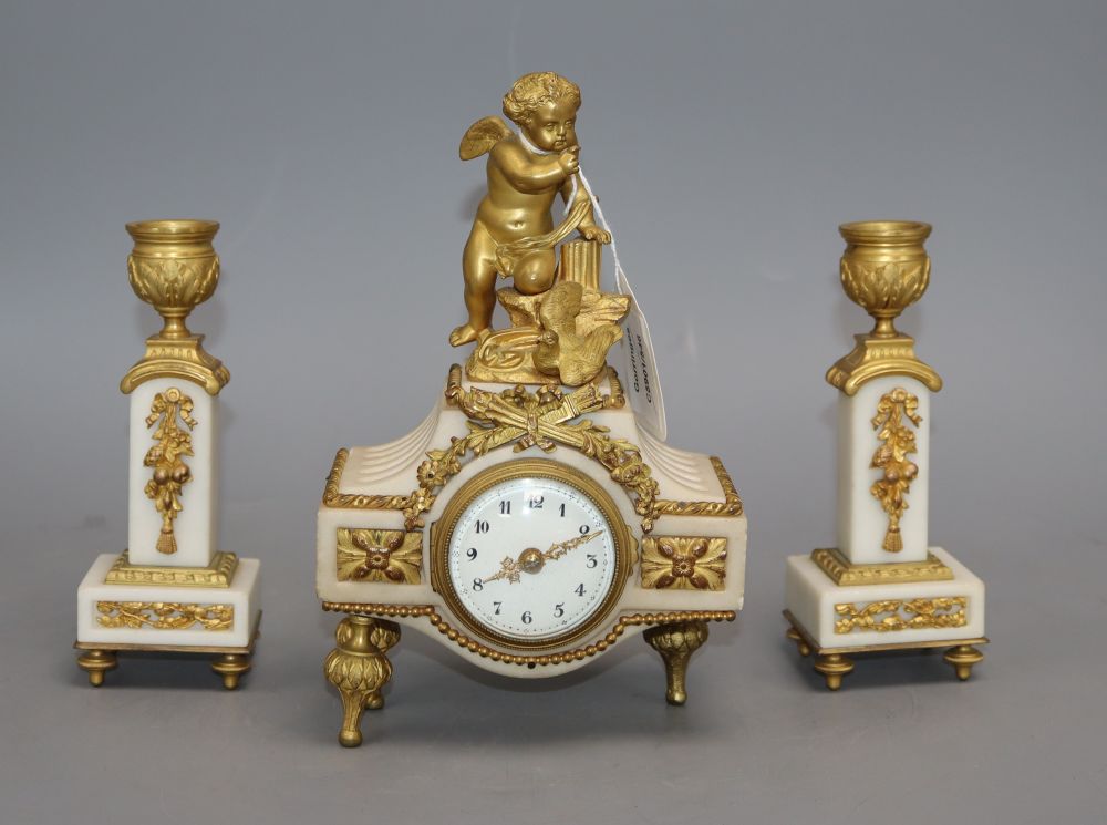 A 19th century ormolu clock garniture, with angelic surmount